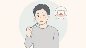 歯ぶらしを手に、歯ぐきからの出血に気づいて困る男性のイラスト
